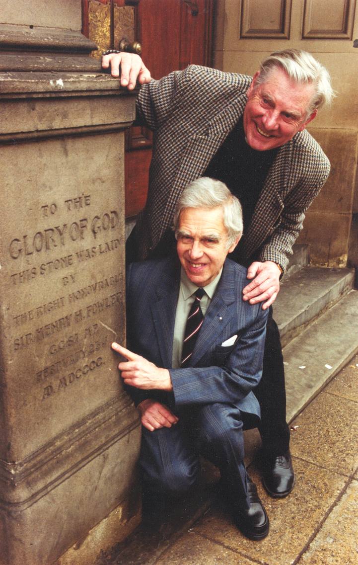 Colour photograph of Rev. Tony Kinch (top) and Dick Rhodes (bottom) and the foundation stone in February 2000