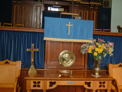 Closeup of pulpit and communion table